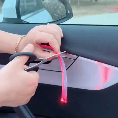 Car interior RGB ambient light strip creates colorful night cabin atmosphere